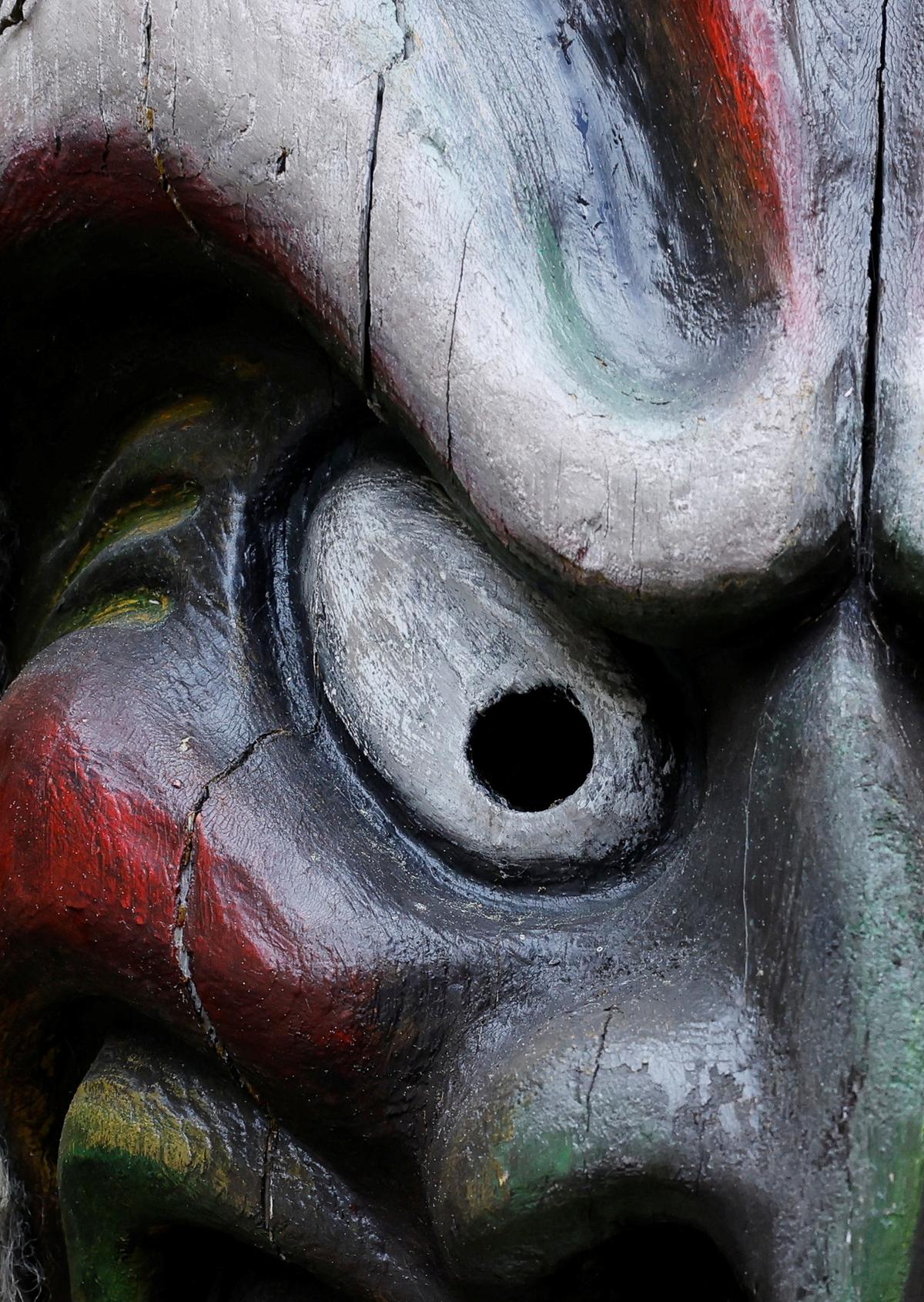 A traditional wooden mask from the Loetschental region is on display in Goppenstein, nearly a year after a massive rock and ice slide triggered by the collapse of the Birch Glacier destroyed much of the village of Blatten, Switzerland, May 20, 2026. REUTERS/Stefan Wermuth