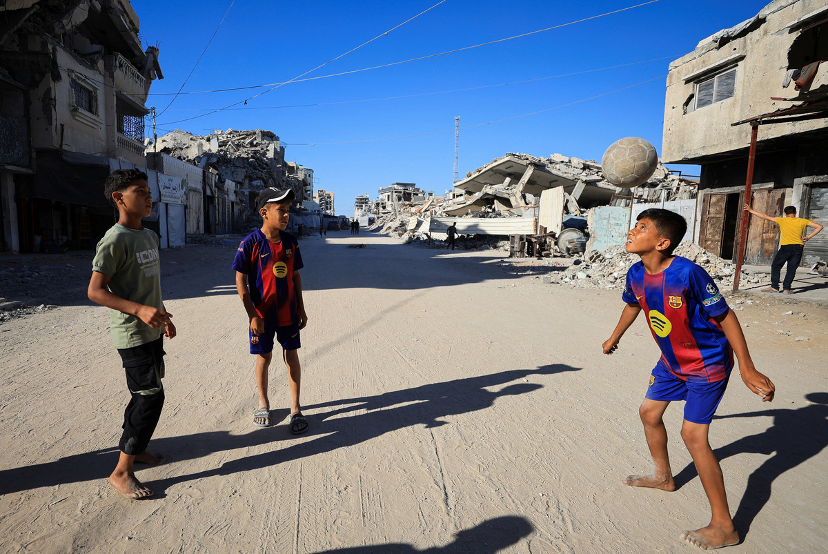 Palestinian children play soccer on a street in Gaza City, June 13, 2026. REUTERS/Dawoud Abu Alkas