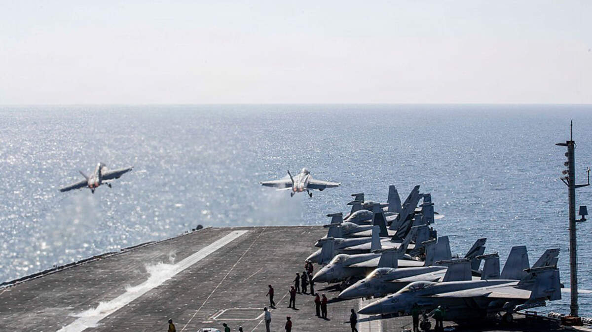 Two F/A-18 Super Hornets launch from the flight deck of the Nimitz-class aircraft carrier USS Abraham Lincoln in the Mediterranean Sea on March 3. 