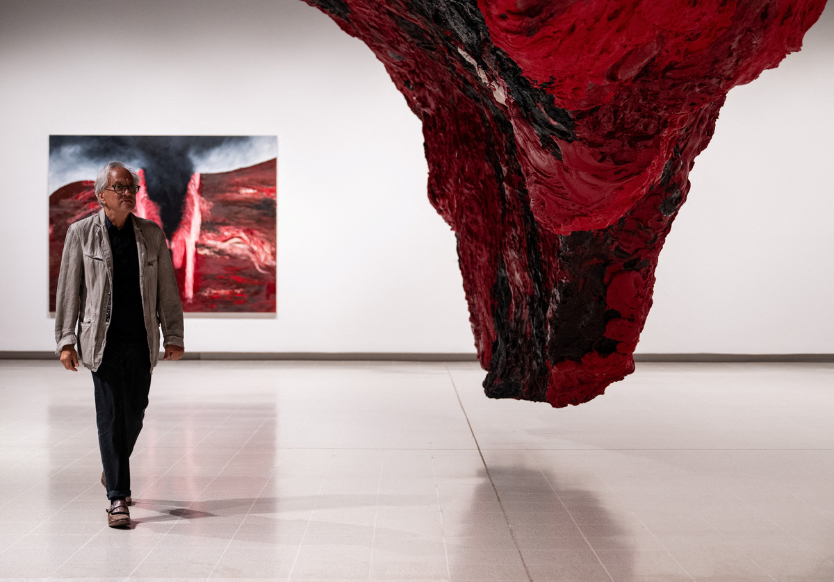 British-Indian sculptor Anish Kapoor poses for a photograph next to his installation 'Mount Moriah at the Gate of the Ghetto' (2022) during the press view for 'Anish Kapoor' at the Hayward Gallery, in London, Britain, June 15, 2026. REUTERS/Chris J. Ratcliffe