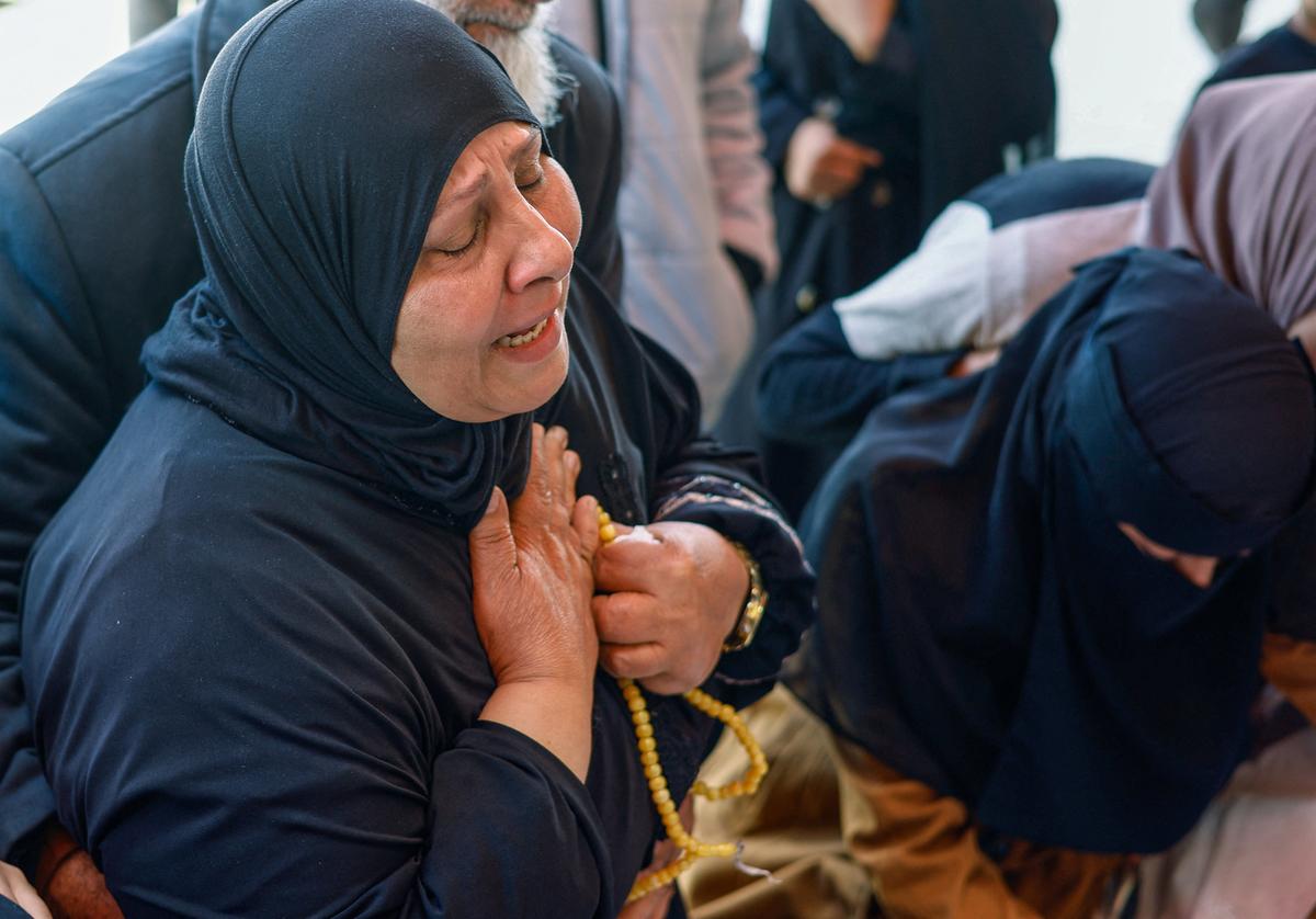 A mourner reacts during the funeral of Palestinians killed in an Israeli strike on a house, according to medics, at Al-Aqsa Martyrs Hospital in Deir al-Balah, in the central Gaza Strip, May 24, 2026. REUTERS/Mahmoud Issa