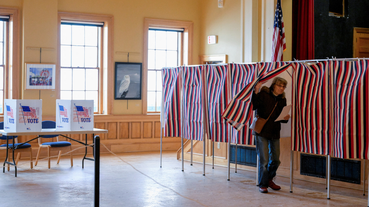 A voter enters a voting booth to fill out a ballot to vote in New Hampshire's first-in-the-nation U.S. presidential primary election at the Medallion Opera House in Gorham, New Hampshire, U.S., January 23, 2024. REUTERS/Faith Ninivaggi