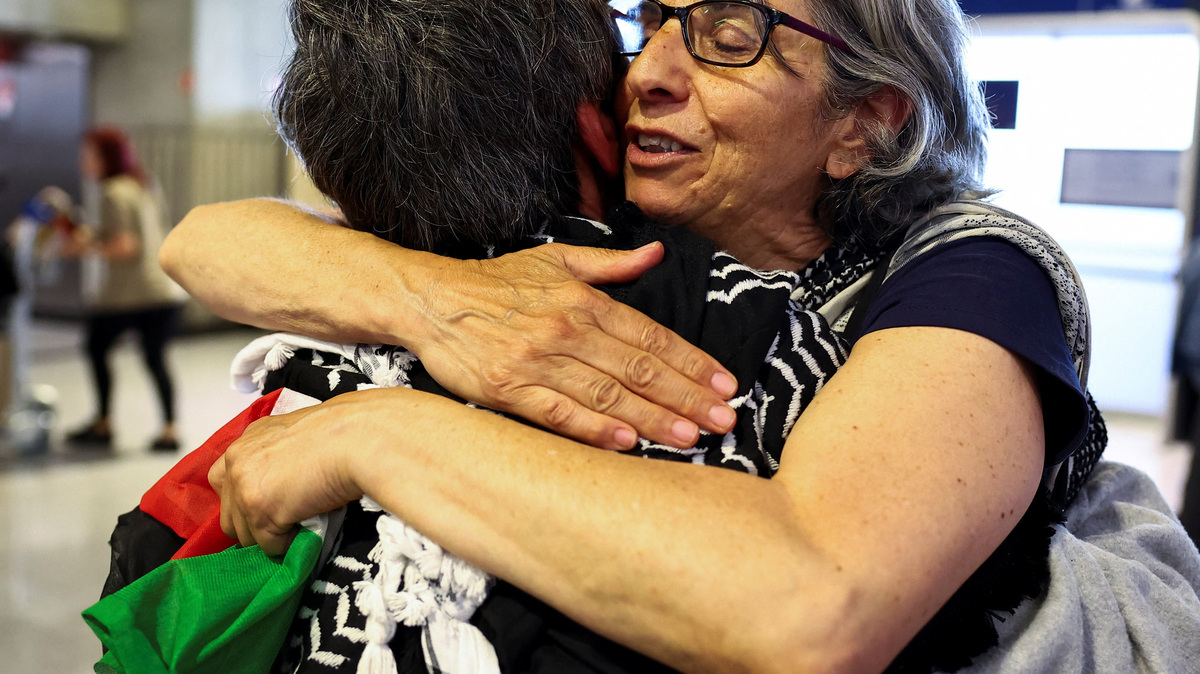 French activists from the Gaza-bound Global Sumud Flotilla, detained by Israeli forces after their vessels were intercepted in international waters in the Mediterranean, arrive at Charles de Gaulle Airport, in Roissy-en-France, near Paris, France May 22, 2026. REUTERS/Abdul Saboor