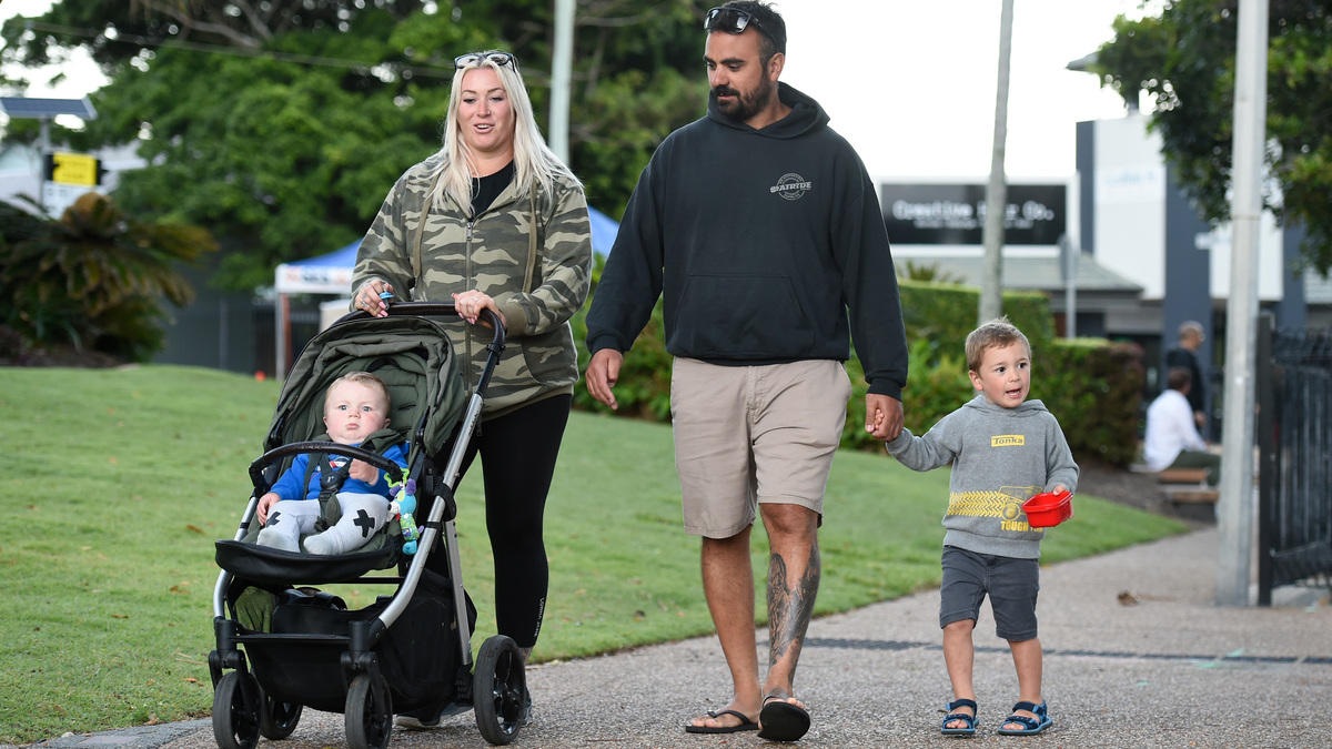 COOLANGATTA, AUSTRALIA - DECEMBER 13: Daniel and Paris Hokin wait for the results of a covid-19 test with their children Andre and Axel at the Griffith St border check point before entering Queensland on December 13, 2021 in Coolangatta, Australia. Queensland's border restrictions have eased to allow fully vaccinated domestic travellers into the state without needing to quarantine. Unvaccinated arrivals must quarantine for 14 days. (Photo by Matt Roberts/Getty Images). 