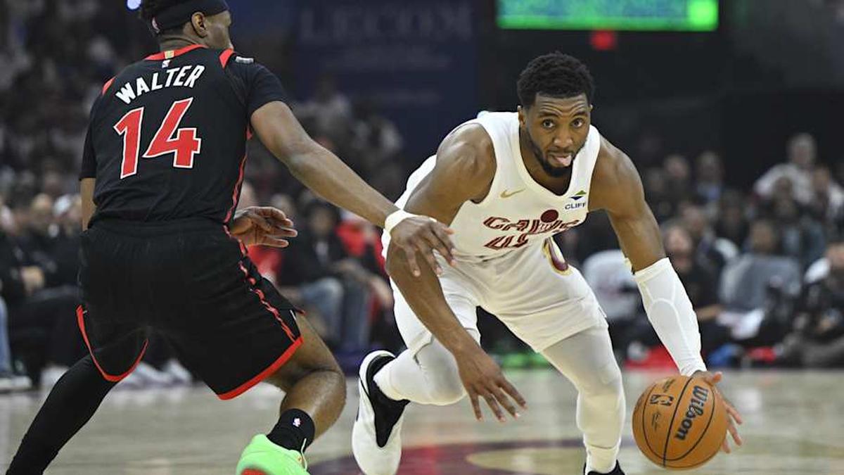  Cavaliers guard Donovan Mitchell dribbles beside Raptors guard Ja'Kobe Walter in Game 5. | David Richard-Imagn Images 