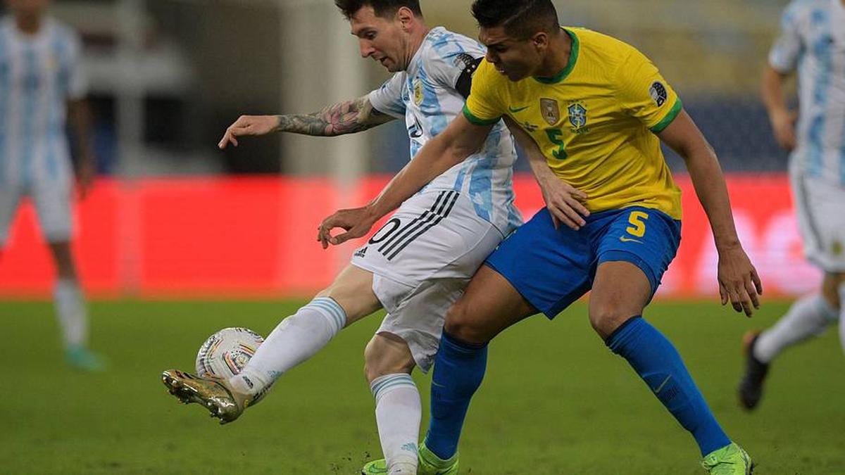  Lionel Messi (left) and Casemiro have faced off 20 times for club and country. | CARL DE SOUZA/AFP/Getty Images 