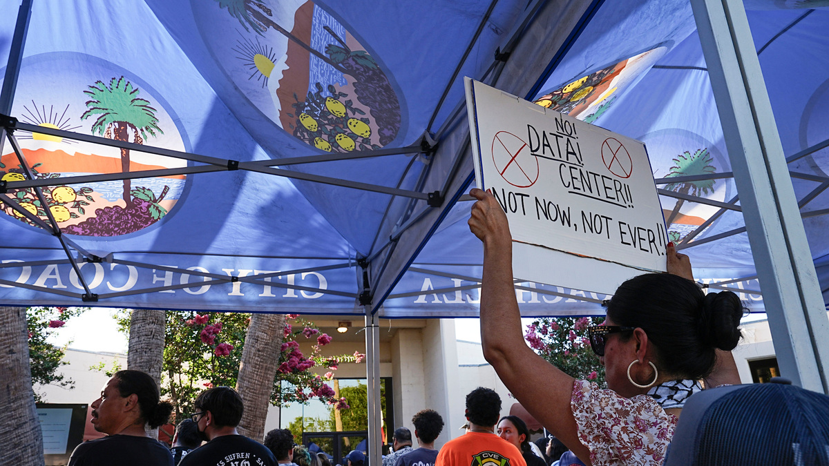 A large crowd gathers outside of the city council chambers to oppose development of a data center in Coachella, Calif., June 4, 2026.