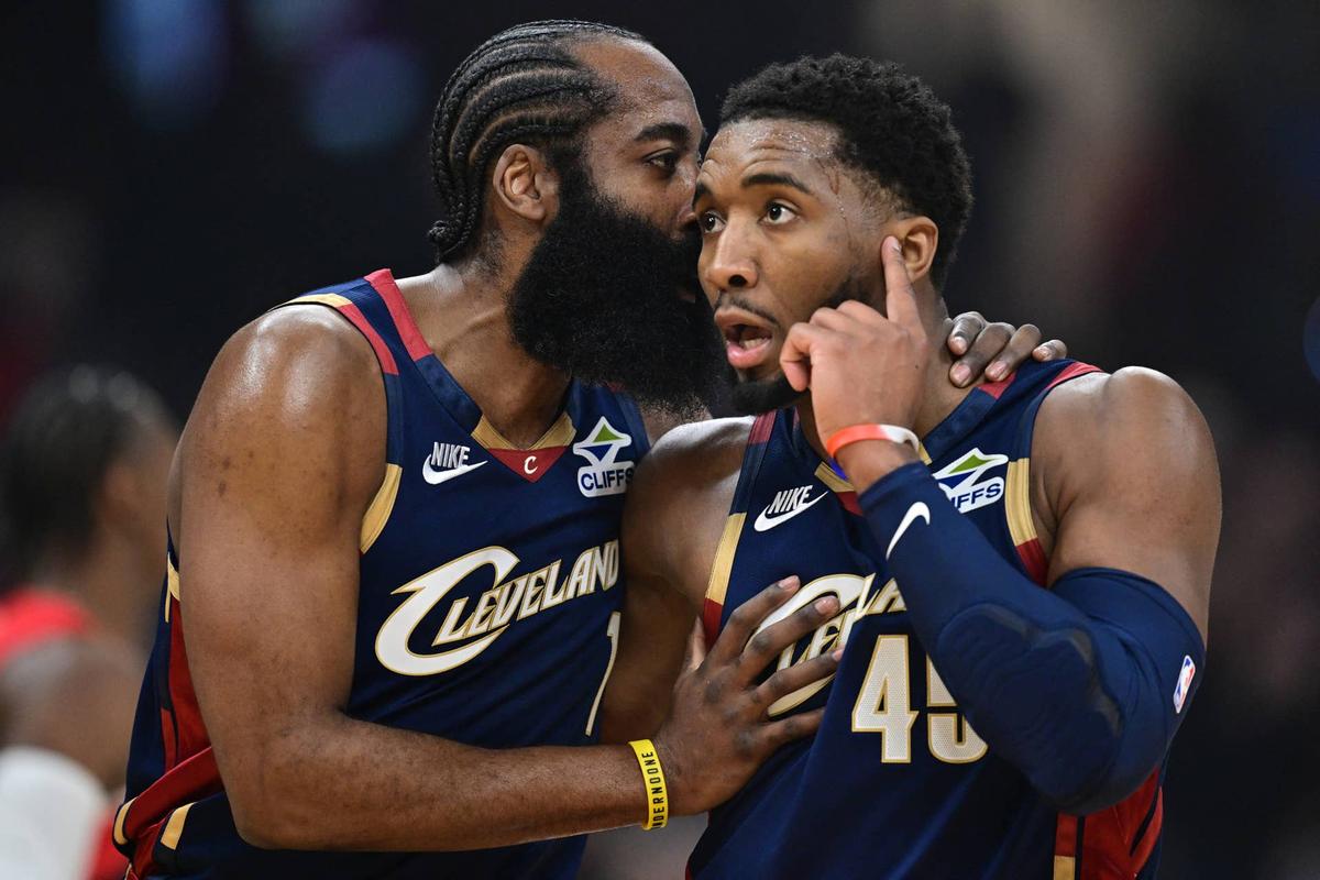  Cleveland Cavaliers guard Donovan Mitchell (45) talks with guard James Harden (1) during the first half during game two of the first round of the 2026 NBA Playoffs against the Toronto Raptors at Rocket Arena. David Dermer-Imagn Images