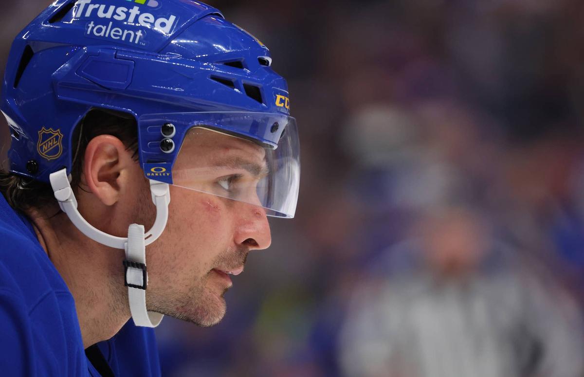  Buffalo Sabres center Sam Carrick (10) waits for a face-off. Timothy T. Ludwig-Imagn Images