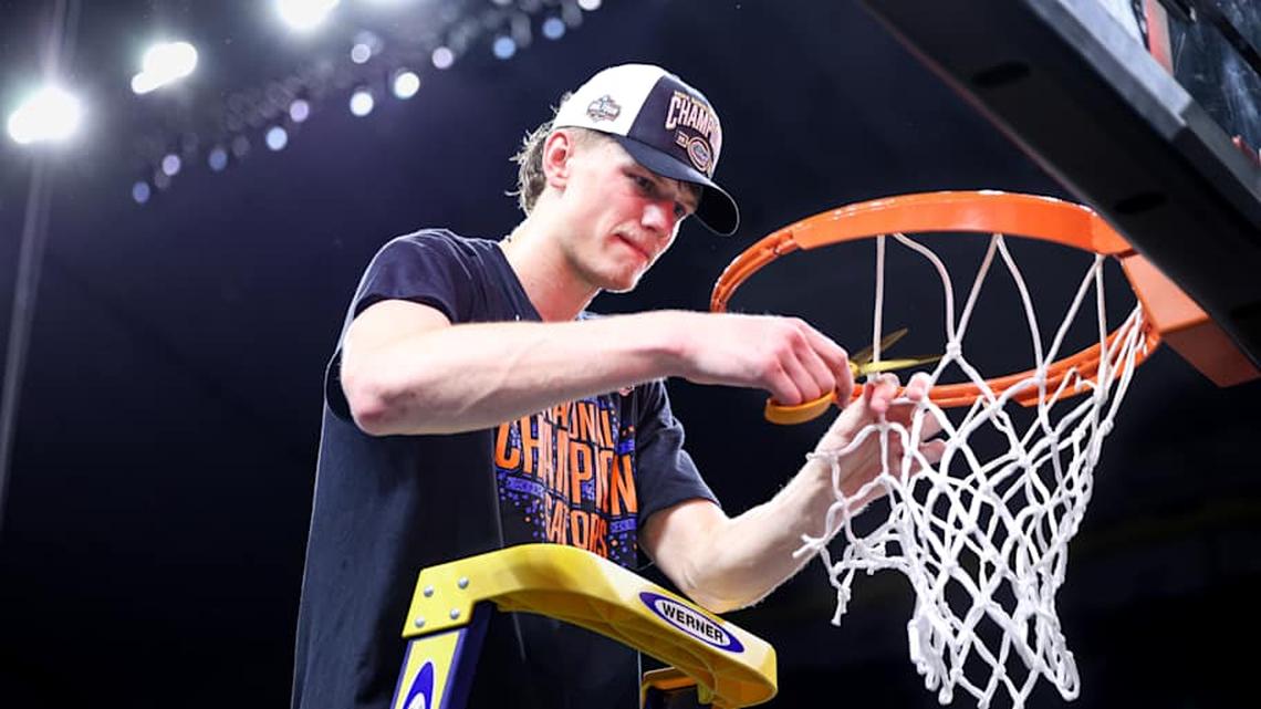  Florida Gators forward Thomas Haugh cuts down the net after the team's win over Houston in the national championship. | Kyle Lander / Gators Illustrated 