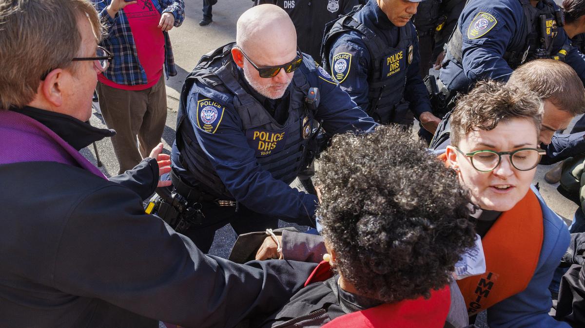 Philadelphia has been the site of repeated protests against ICE, and sometimes against city officials who activists say must do more to protect undocumented residents. Here an officer with U.S Department of Homeland Security moves a member of the clergy during a No ICE Philly protestor outside the Immigration and Customs Enforcement in March. (Alejandro A Alvarez/The Philadelphia Inquirer/TNS)