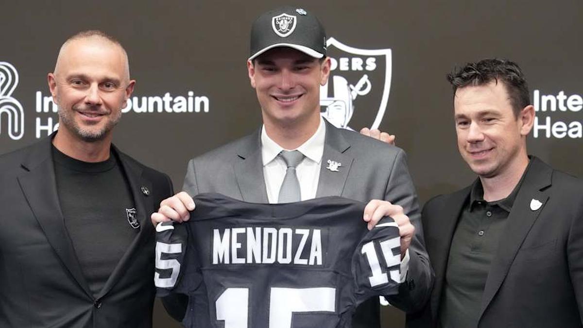  Apr 24, 2026; Henderson, NV, USA; Las Vegas Raiders quarterback Fernando Mendoza (center) poses with general manager John Spytek (left) and head coach Klint Kubiak at introductory press conference at Intermountain Health Performance Center after being selected as the No. 1 pick in the 2026 NFL Draft. Mandatory Credit: Kirby Lee-Imagn Images | Kirby Lee-Imagn Images 