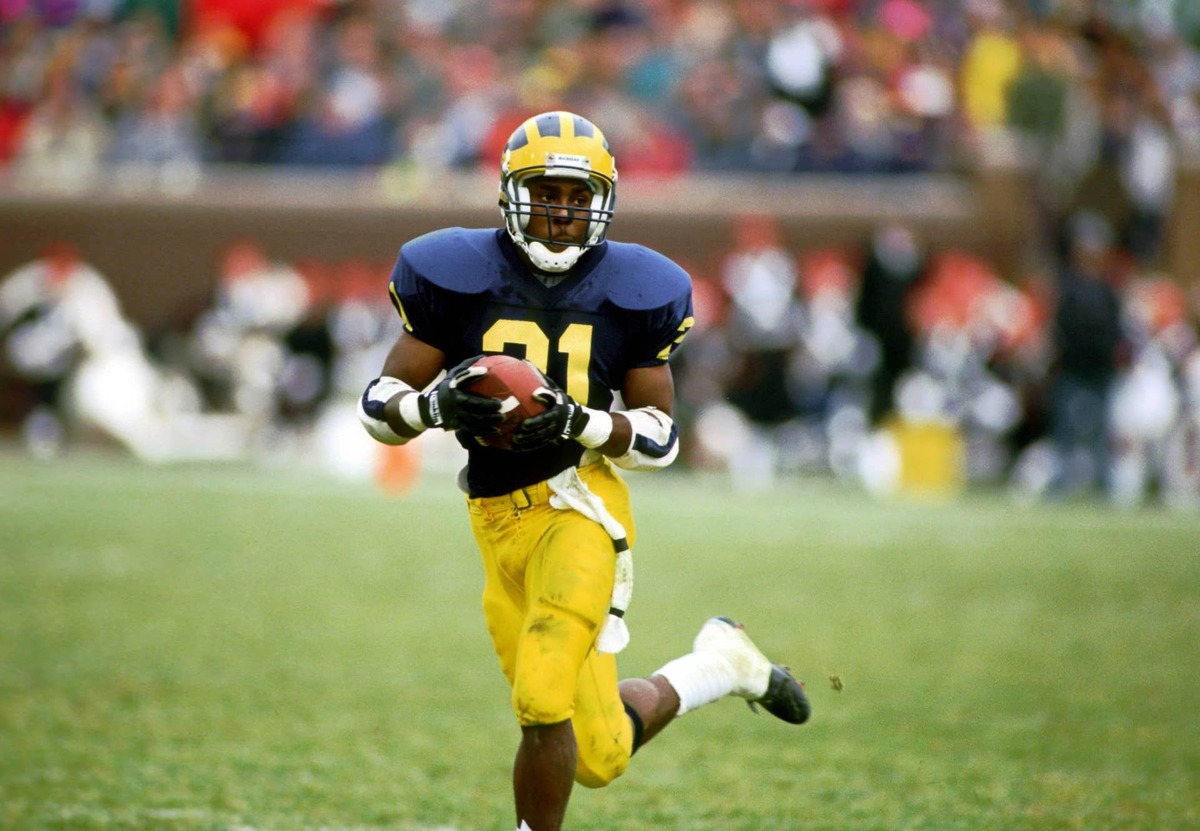  Michigan receiver Desmond Howard returns a punt against the Ohio State Buckeyes at Michigan Stadium. USA TODAY Sports