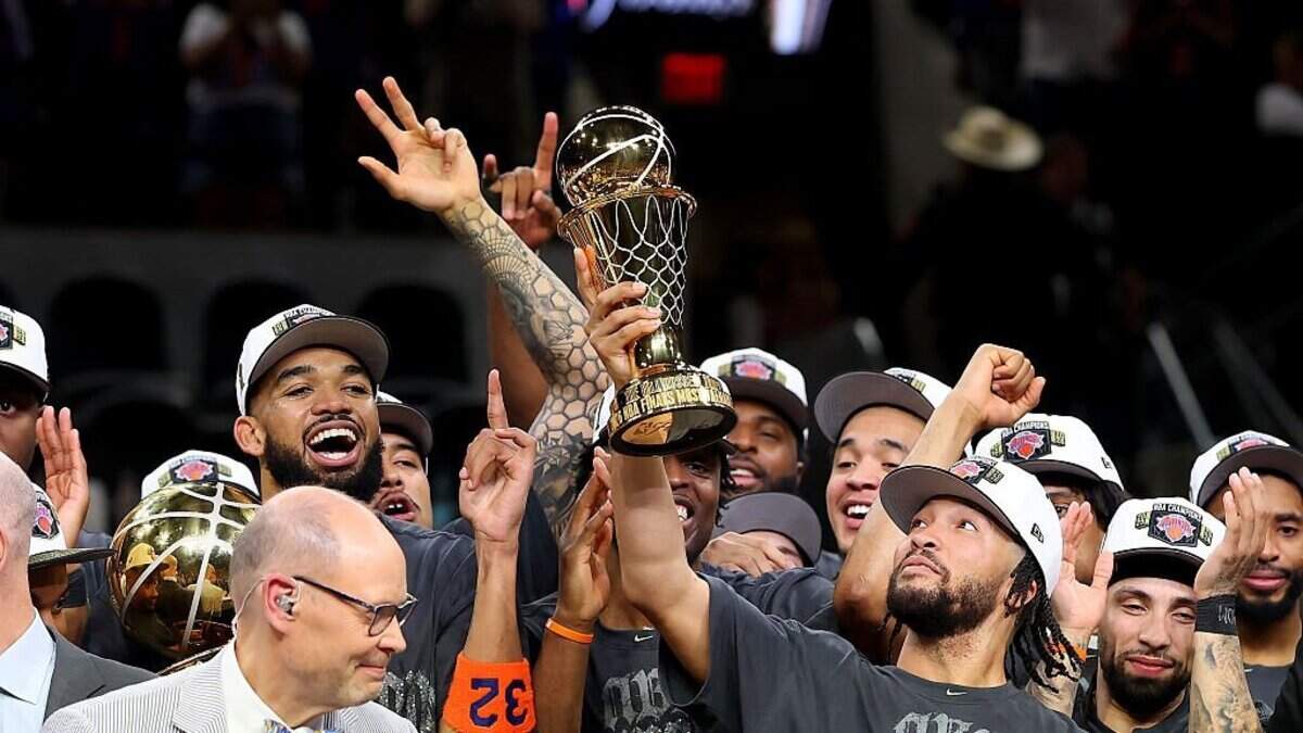 Jalen Brunson, seen here hoisting the Bill Russell NBA Finals Most Valuable Player Award trophy on Saturday, reached sports legend territory by leading the New York Knicks to their first NBA title in 53 years. 