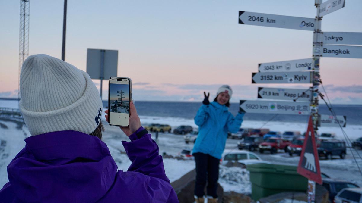 Chinese tourists from Shanghai take photos in front of the famous sign posts located at the airport at Longyearbyen on the Norwegian archipelago of Svalbard on Feb. 18. There are no outward signs of jitters, at least not yet: people in Svalbard are going about their daily lives as normal despite speculation that this Norwegian archipelago could be the next Arctic territory coveted by the US or Russia. "Today Greenland, tomorrow Svalbard?" -- Terje Aunevik, mayor of Svalbard's main town Longyearbyen, says he has been asked the question many times.