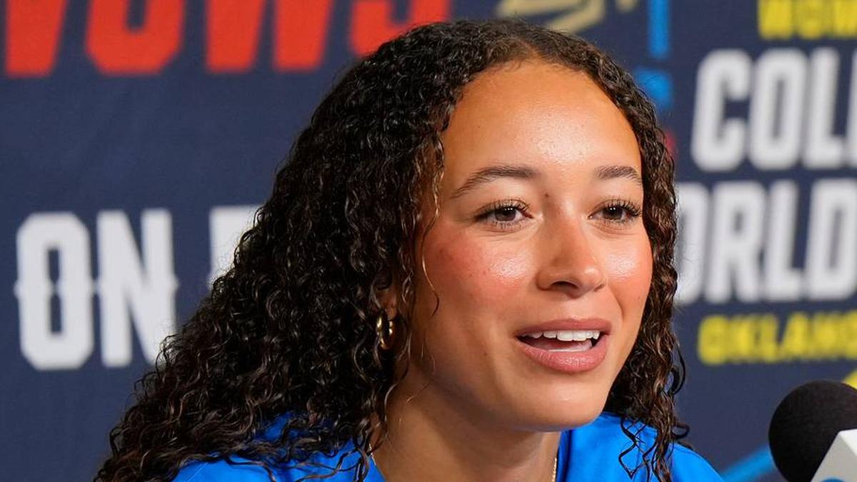 Taylor Tinsley speaks as coach Kelly Inouye-Perez listens of UCLA interviews during the Women's College World Series (WCWS) media day at Devon Park in Oklahoma City, Wednesday, May 27, 2026. | DOUG HOKE/THE OKLAHOMAN / USA TODAY NETWORK via Imagn Images 
