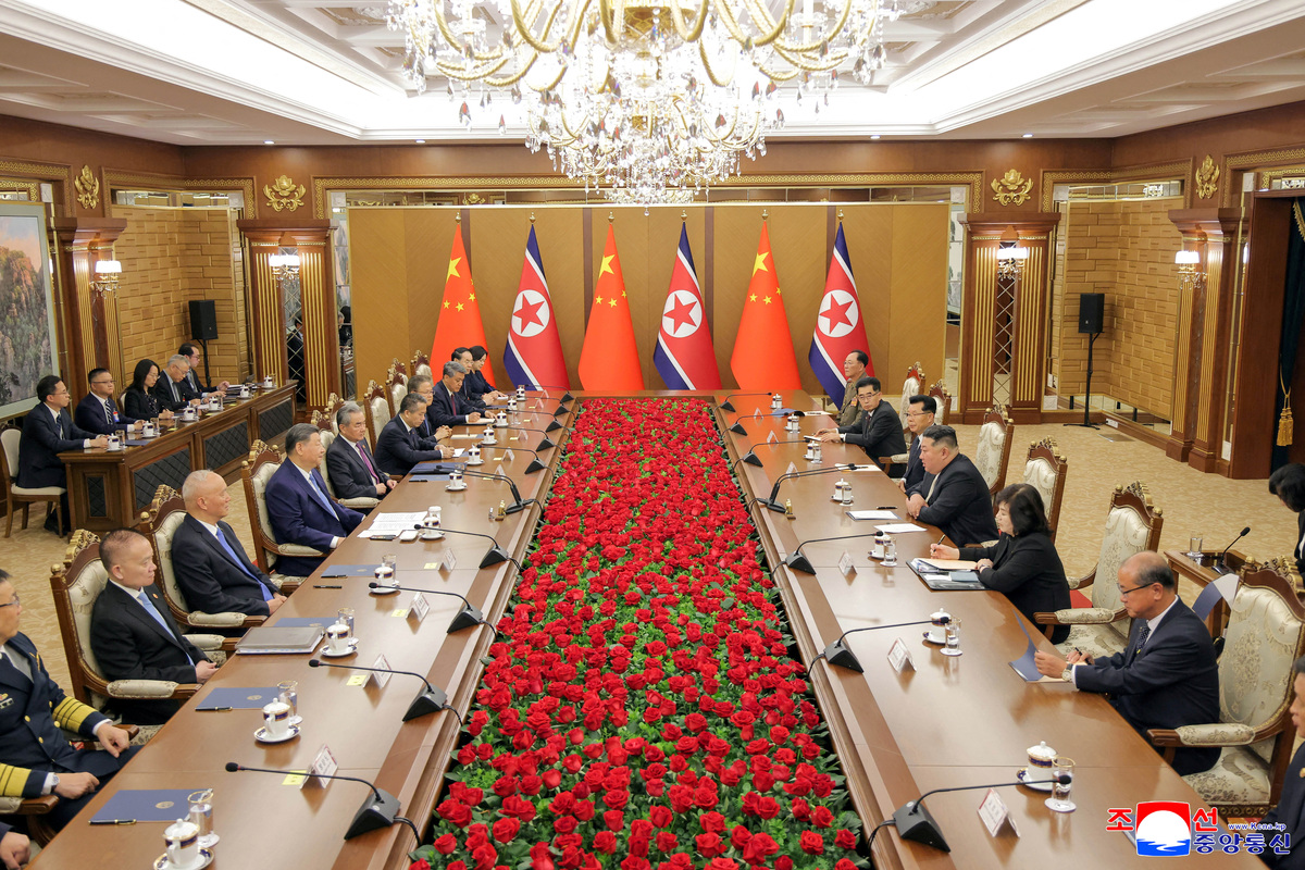 Chinese President Xi Jinping and North Korean leader Kim Jong Un sit facing each other during talks, amid Xi's state visit to Pyongyang, North Korea, June 8, 2026, in this picture released by North Korea's official Korean Central News Agency.   KCNA via REUTERS