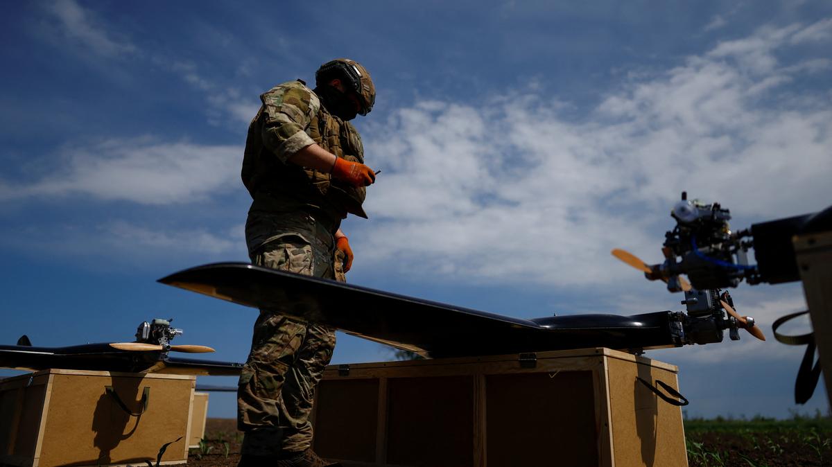 A service member of the 1st Center of Unmanned Aerial Systems of the Unmanned Systems Forces prepares middle strike drones for a launch, amid Russia's attack on Ukraine, in an undisclosed location in Ukraine, on an undisclosed date, 2026. REUTERS/Valentyn Ogirenko