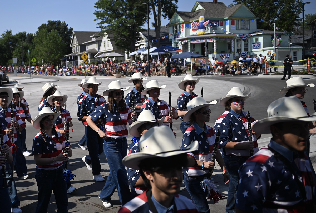 A band marches during the Greeley Stampede's Independence Day parade in Greeley, Colo., July 4, 2026. America celebrates the 250th anniversary of its independence today, with people from one end of the country to the other marking the milestone with fireworks, parades and concerts. (Mark Makela/The New York Times)