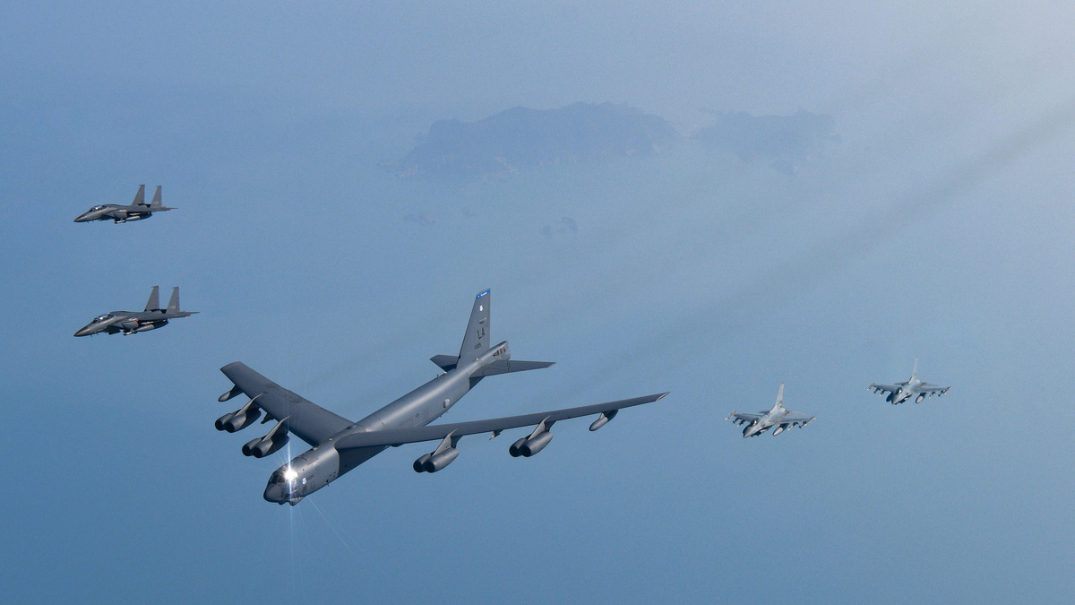 In this handout image released by the South Korean Defense Ministry, a U.S. Air Force B-52H bomber (center), and South Korean Air Force F-15K and KF-16 fighter jets fly over South Korea Peninsula during a joint air drill on March 6, 2023, at an undisclosed location in South Korea. (South Korean Defense Ministry/Getty Images/TNS)