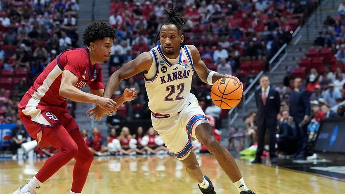  Mar 22, 2026; San Diego, CA, USA; Kansas Jayhawks guard Darryn Peterson (22) controls the ball against St. John's Red Storm guard Oziyah Sellers (4) in the second half during a second round game of the men's 2026 NCAA Tournament at Viejas Arena. Mandatory Credit: Kirby Lee-Imagn Images | Kirby Lee-Imagn Images 