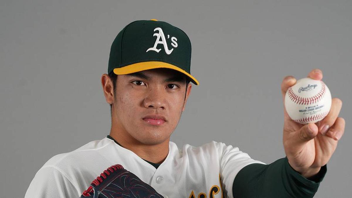  Athletics pitcher Wei-En Lin (81) poses for Photo Day at HoHoKam Stadium. | Rick Scuteri-Imagn Images 