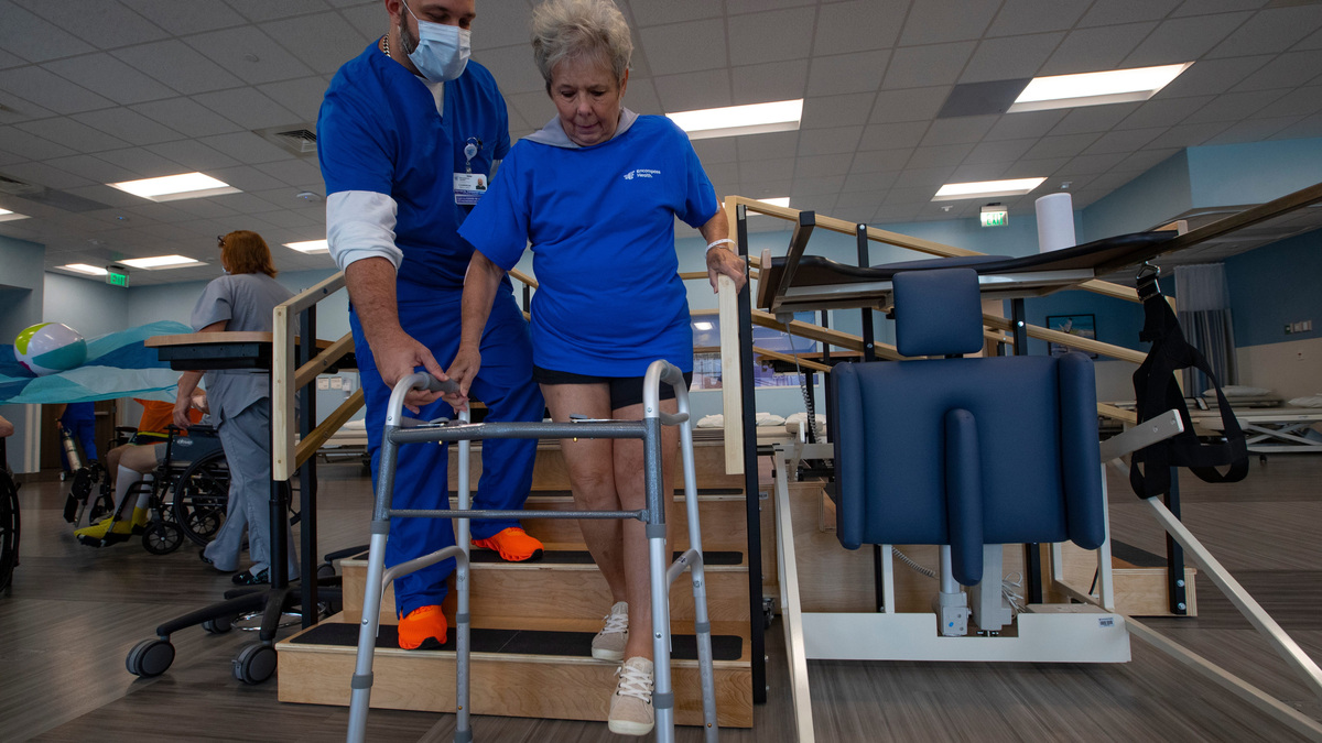 Cameron Ballard, a physical therapist assistant, works with patient Cindy Schmidt of Estero on hip strengthening exercises. 
Southwest Florida's largest hospitals have entered into joint ventures with Encompass Health, for inpatient rehab hospitals.