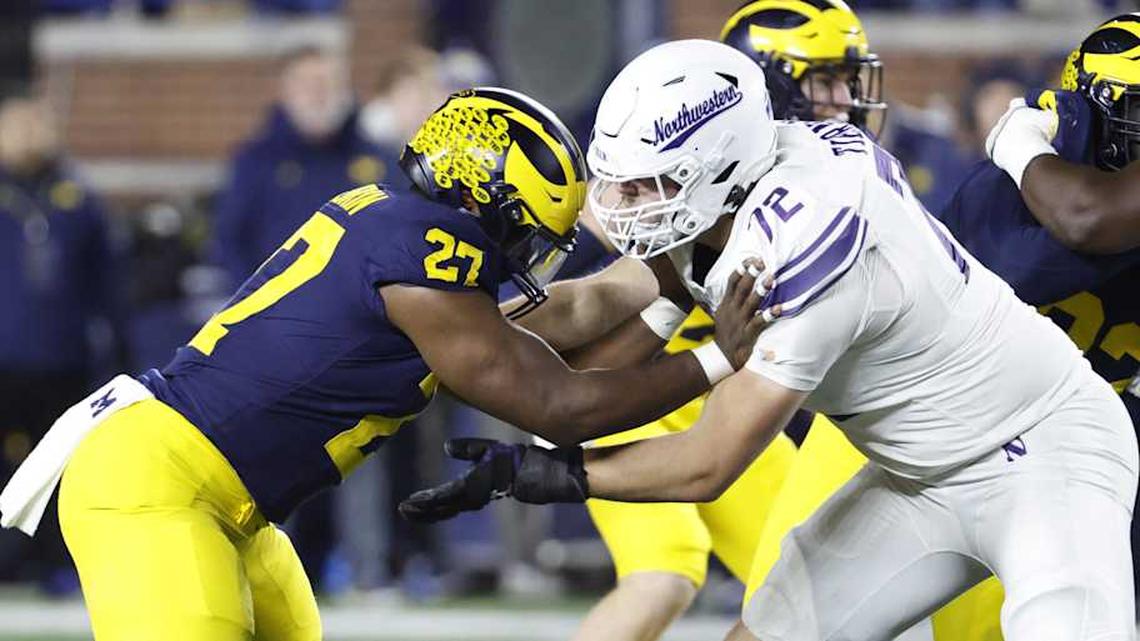  Nov 23, 2024; Ann Arbor, Michigan, USA; Northwestern Wildcats offensive lineman Caleb Tiernan (72) blocks Michigan Wolverines defensive end Tyler McLaurin (27) in the second half at Michigan Stadium. Mandatory Credit: Rick Osentoski-Imagn Images | Rick Osentoski-Imagn Images 