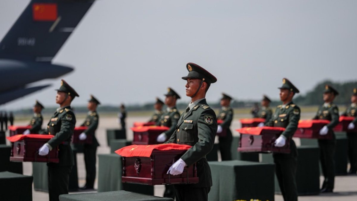 Coffins containing the remains of Chinese People's Volunteers (CPV) soldiers are about to be loaded onto vehicles at Taoxian International Airport in Shenyang, northeast China's Liaoning Province. Photo by PAN YULONG / XINHUA / EPA
