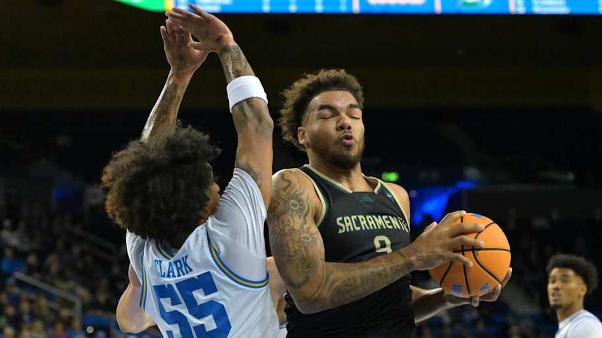  Nov 18, 2025; Los Angeles, California, USA; UCLA Bruins guard Skyy Clark (55) defends Sacramento State Hornets forward Jeremiah Cherry (9) | Jayne Kamin-Oncea-Imagn Images 