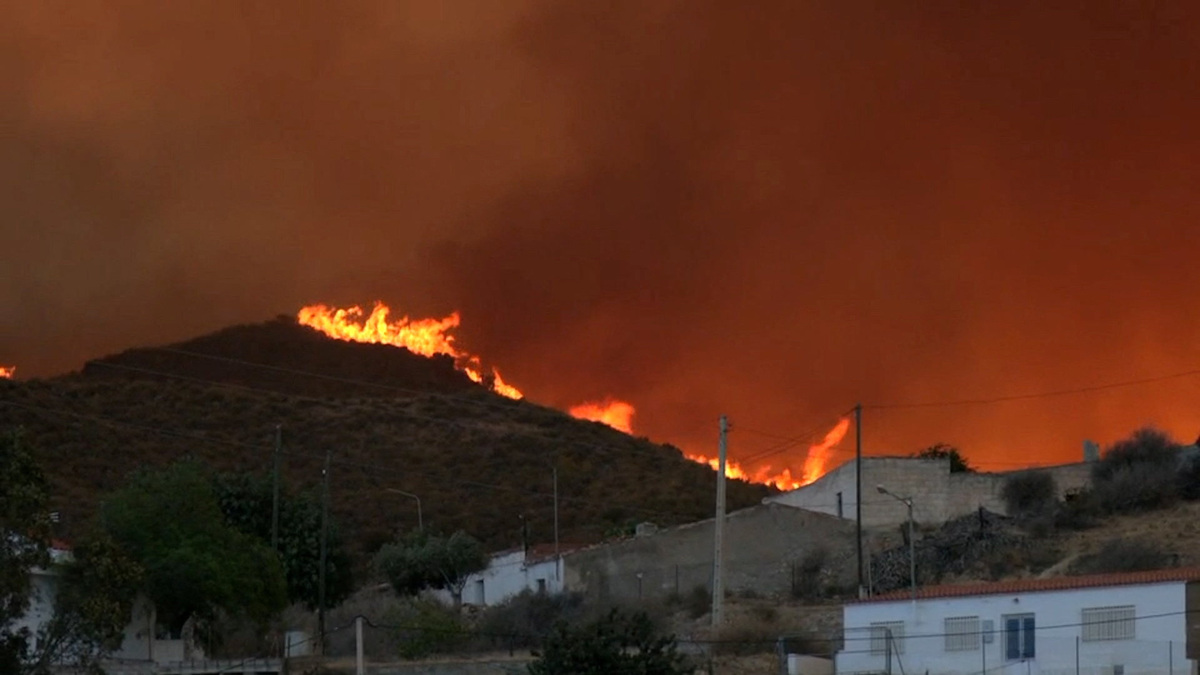 Smoke and flames rise during a wildfire in Los Gallardos, Spain, July 9, 2026 in this screengrab taken from a handout video. Forta/Handout via REUTERS