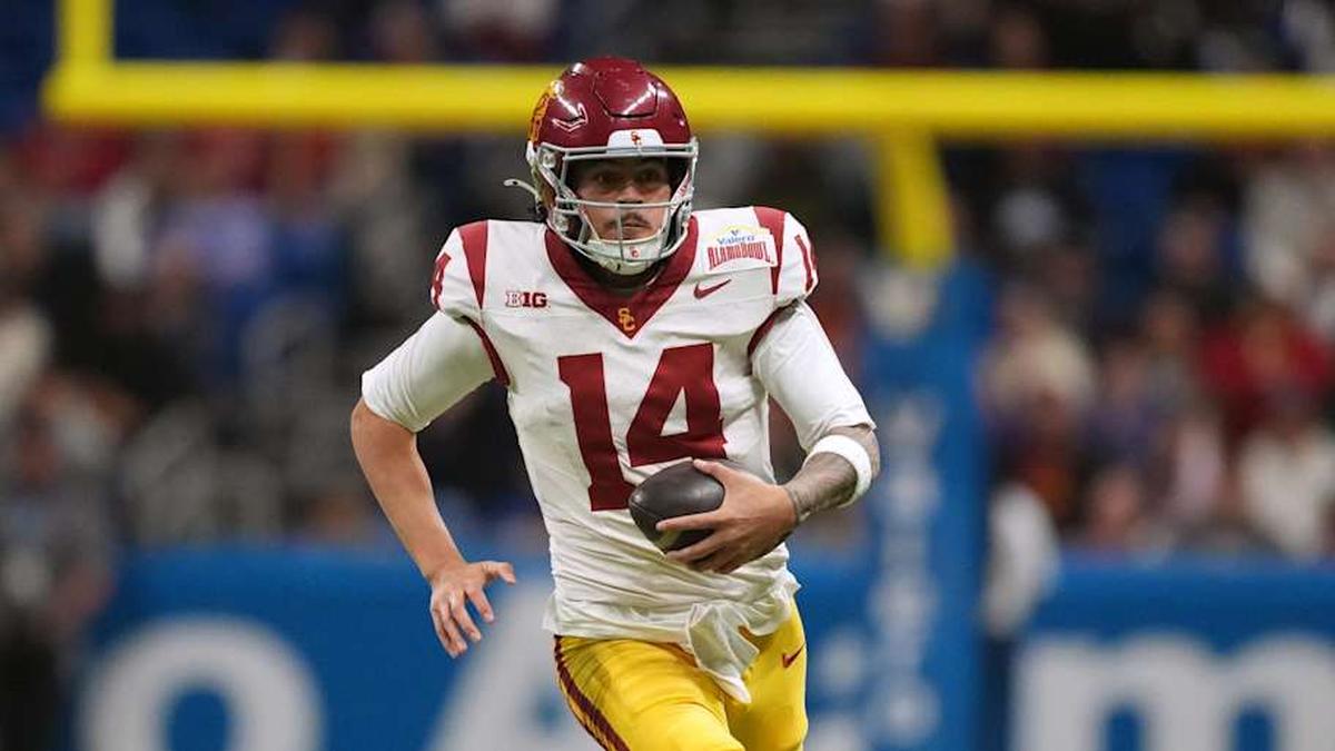  Dec 30, 2025; San Antonio, TX, USA; Southern California Trojans quarterback Jayden Maiava (14) carries the ball against the TCU Horned Frogs in the second half during the Alamo Bowl at Alamodome. Mandatory Credit: Kirby Lee-Imagn Images | Kirby Lee-Imagn Images 