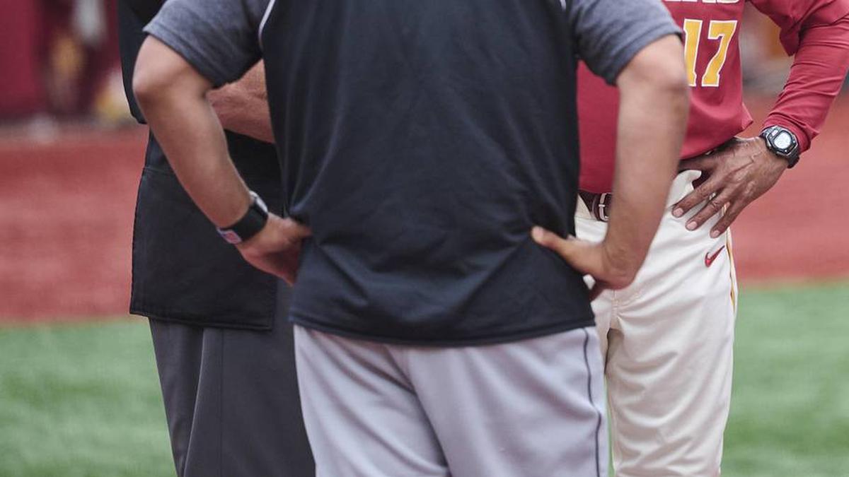  May 31, 2025; Corvallis, OR, USA; USC head coach Andy Stankiewicz visits with official before a game against Saint Mary's at the NCAA Corvallis Regional at Goss Stadium. Mandatory Credit: Troy Wayrynen-Imagn Images | Troy Wayrynen-Imagn Images 