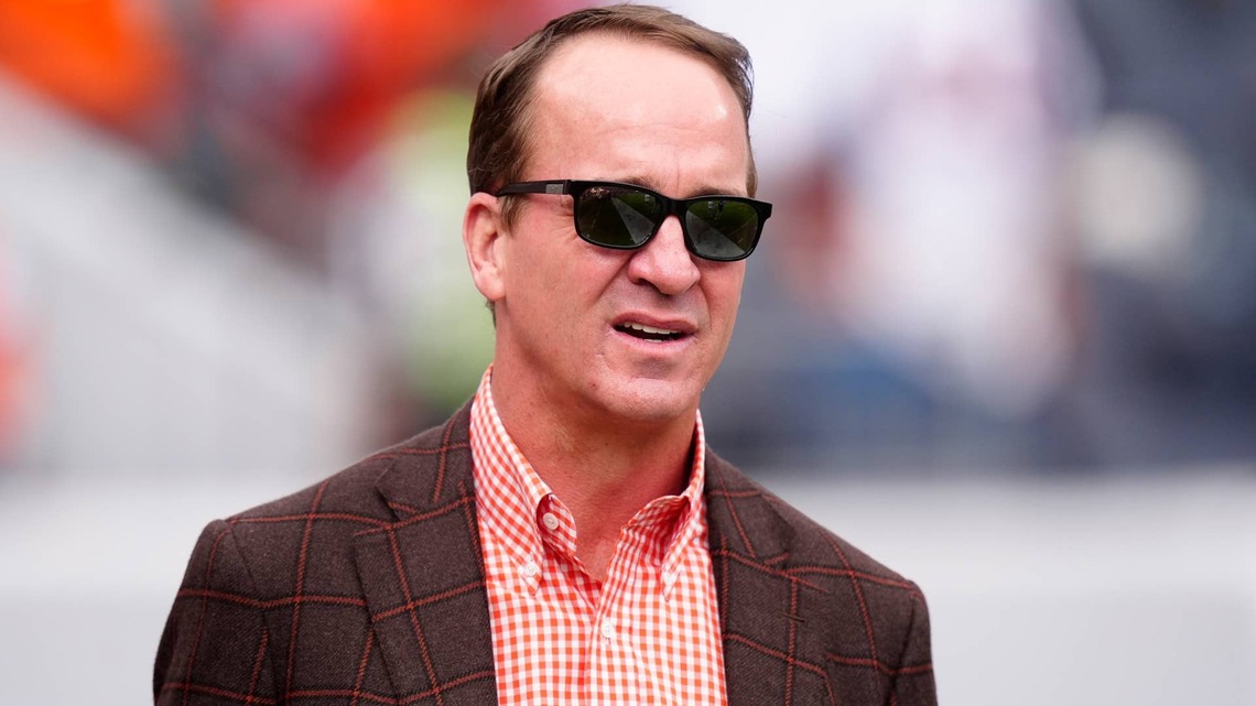 Peyton Manning's unsigned 1998 SkyBox rookie card sold for a record $414,800 at Heritage Auctions; the one-of-one nearly doubled the prior Manning record of $207,400 