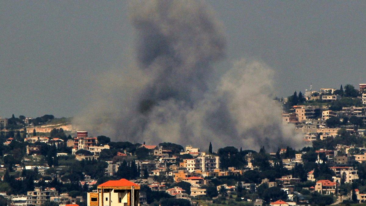Smoke billows from an Israeli airstrike on the southern Lebanese village of Arnoun. The Israeli military has called on residents of more than a dozen villages in southern Lebanon to immediately evacuate ahead of expected attacks targeting Hezbollah, despite a fragile ceasefire agreement intended to halt the fighting. (Stringer/dpa/TNS)