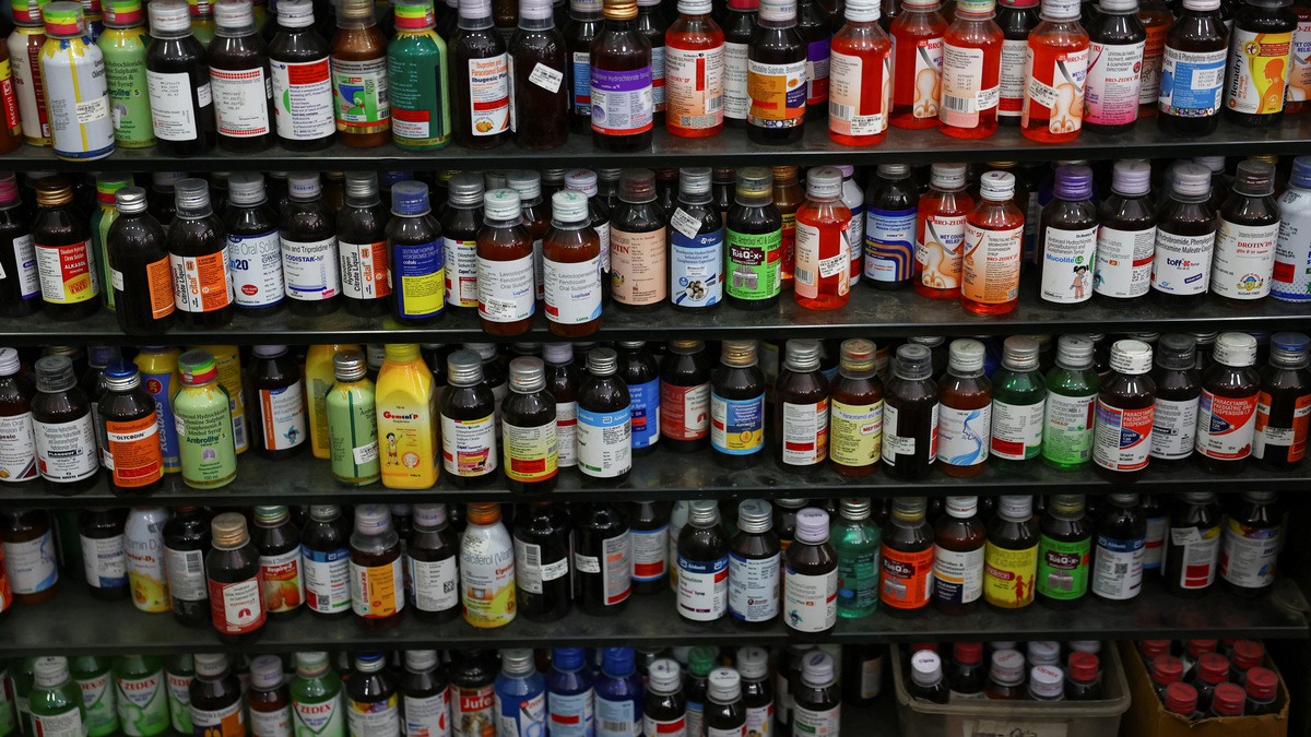 Bottles of cough syrup stand on shelfs at a chemist's in New Delhi, India, June 16, 2026. REUTERS/Anushree Fadnavis