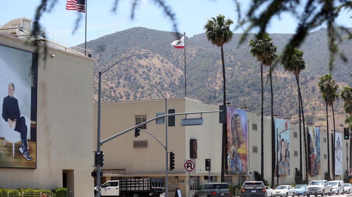 The Warner Bros Studio lot is seen from the street in Burbank on Wednesday, June 2, 2021 in Los Angeles. Regulators should weigh how the Paramount-Warner Bros. Discovery merger affects California’s small businesses, AAPI entrepreneurs and the creative economy.