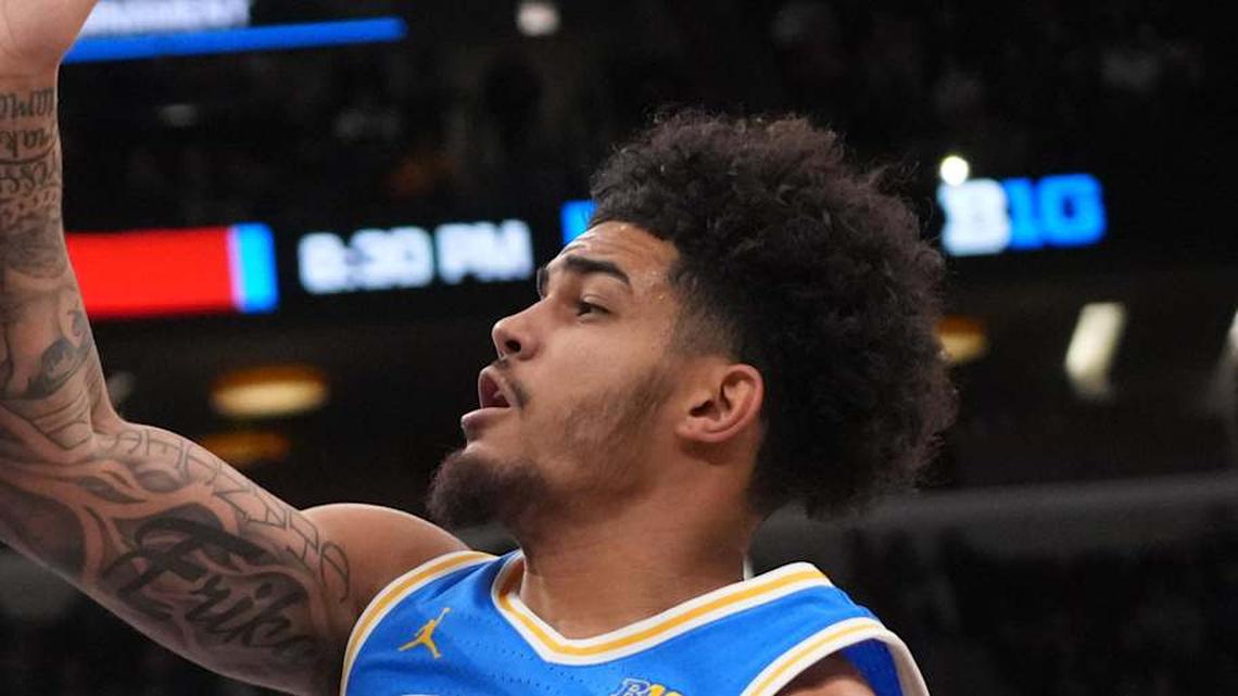  Mar 13, 2026; Chicago, IL, USA; UCLA Bruins guard Eric Freeny (8) defends Michigan State Spartans forward Coen Carr (55) during the first half at United Center. Mandatory Credit: David Banks-Imagn Images | David Banks-Imagn Images 