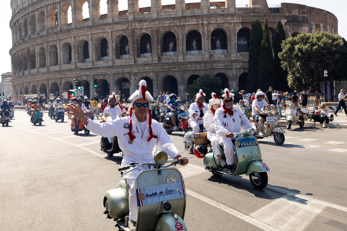 Vespa riders from France drive past the Colosseum the last day of “Vespa Roma 2026 - 80 Years of an Icon”, a four days global gathering marking the 80th anniversary of the iconic Italian scooter brand, in Rome, Italy, June 27, 2026. REUTERS/Remo Casilli