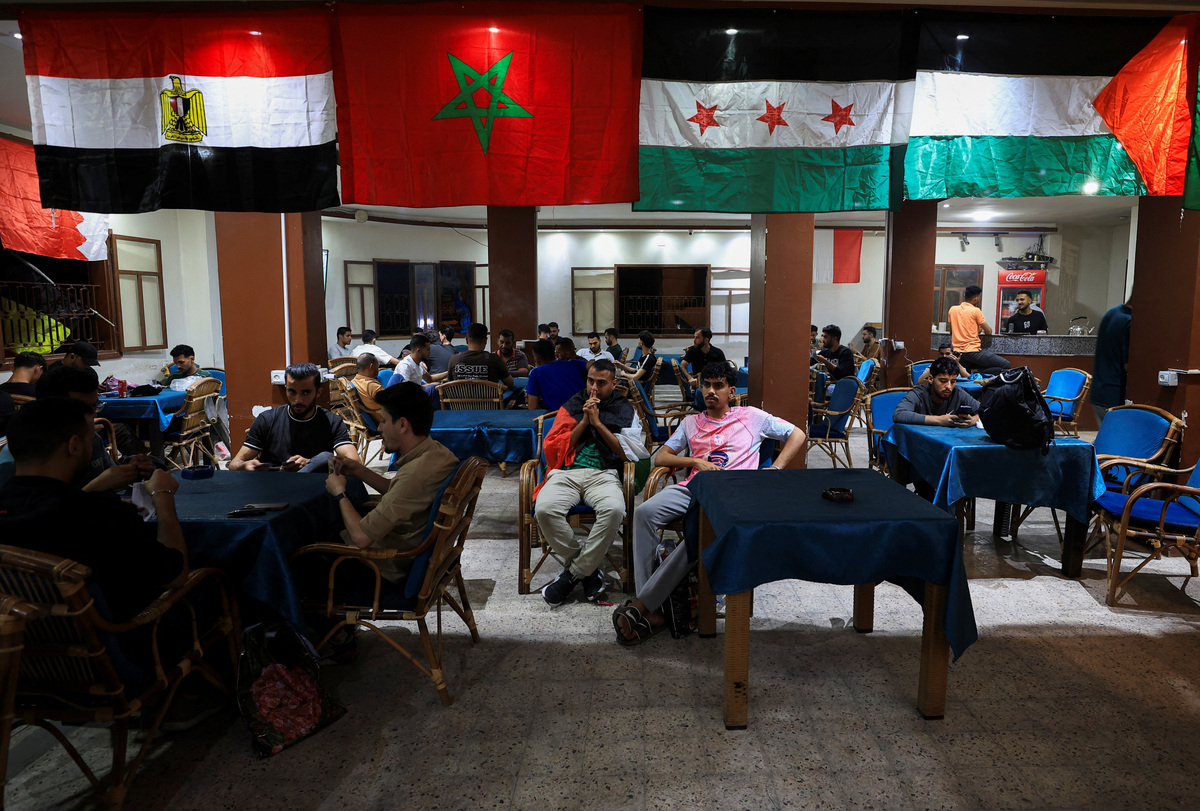 Palestinian soccer fans watch 2026 World Cup matches at a cafe in Gaza City, June 11, 2026. REUTERS/Dawoud Abu Alkas