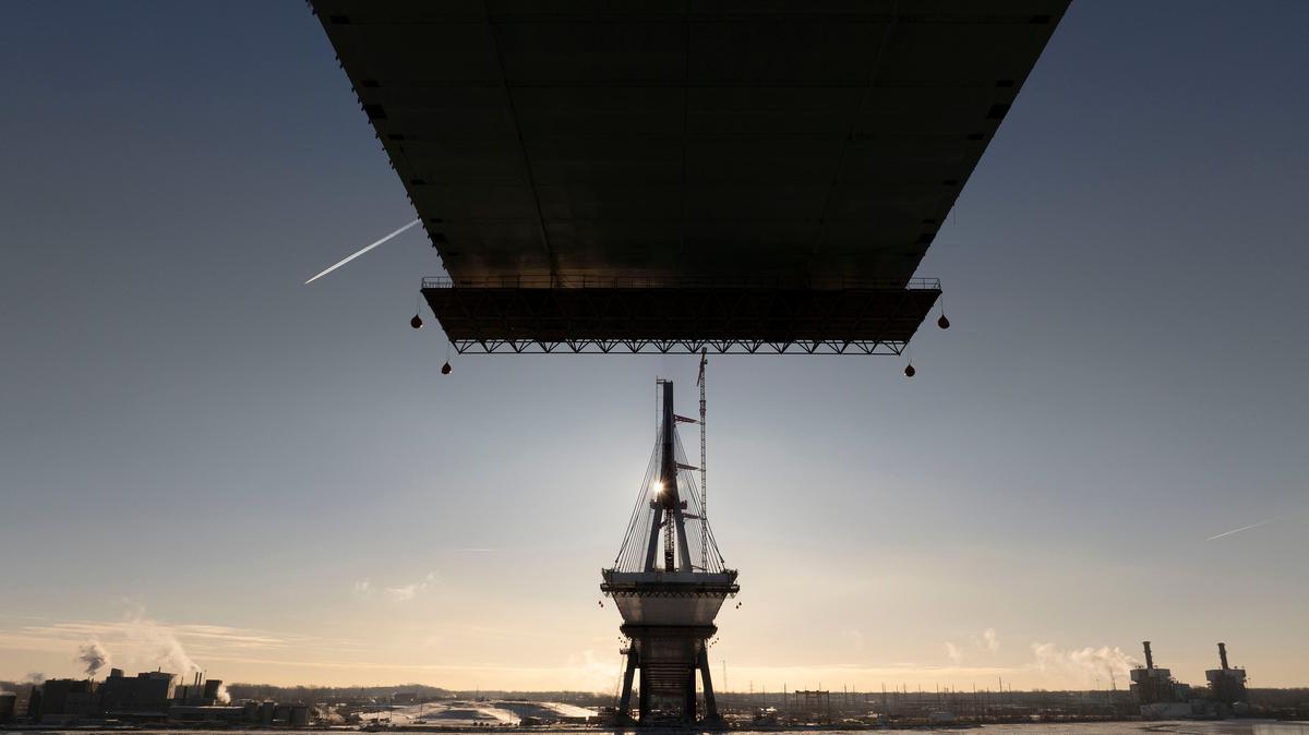 The sun rises over the Canadian tower of the Gordie Howe International Bridge in Detroit, Jan. 21, 2024. (David Guralnick/The Detroit News/TNS)