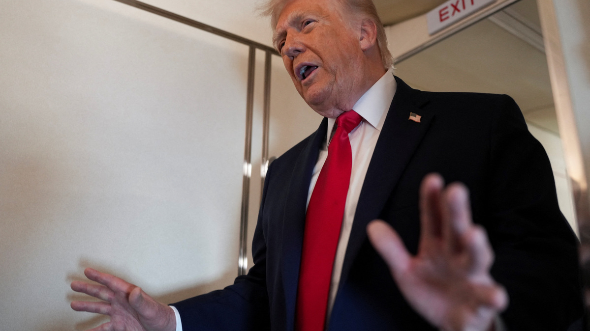 FILE PHOTO: U.S. President Donald Trump speaks to members of the media on board Air Force One while flying from Joint Base Andrews to Chippewa Valley Regional Airport in Eau Claire, Wisconsin, U.S., June 5, 2026. REUTERS/Nathan Howard/File Photo