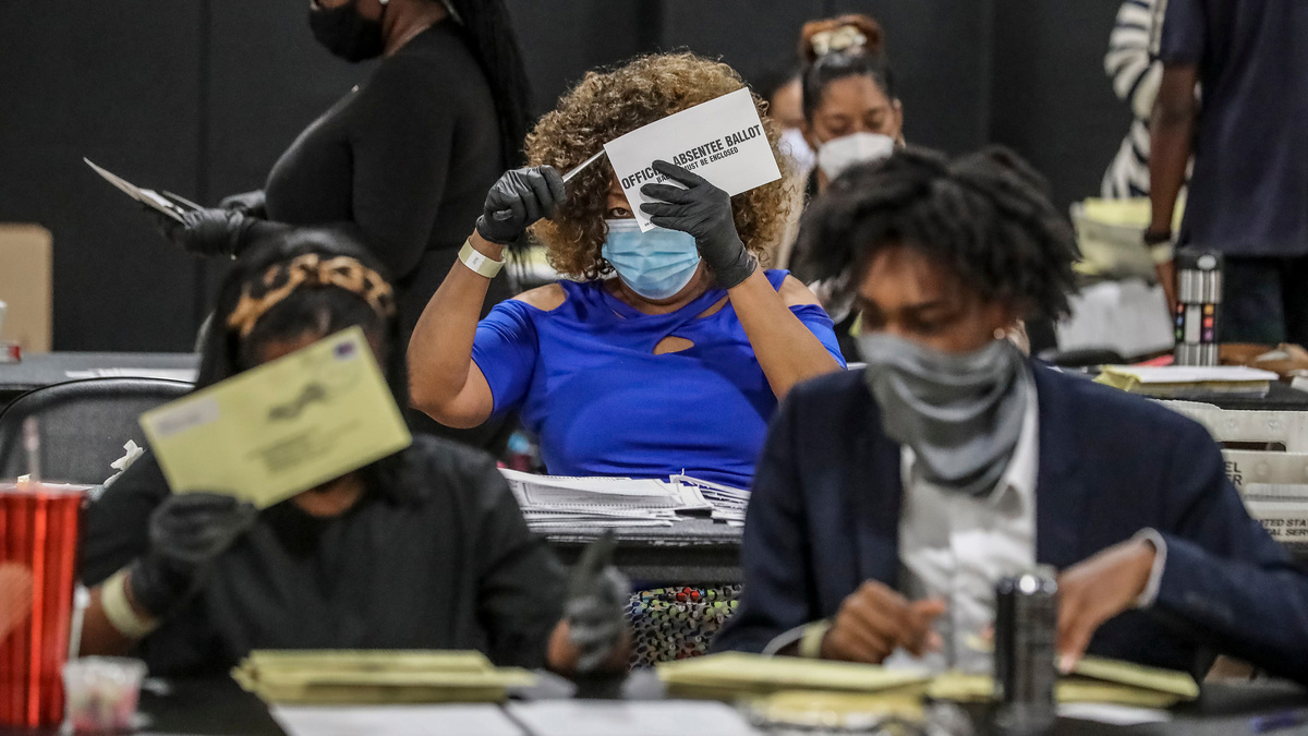 Some 70 Fulton County (Georgia) Registration & Election Board workers handled some 20,000 absentee ballots on Aug. 11, 2020, at State Farm Arena in Atlanta. A federal judge rejected an effort by the U.S. Justice Department to obtain information on election workers in Fulton County related to the 2020 election.