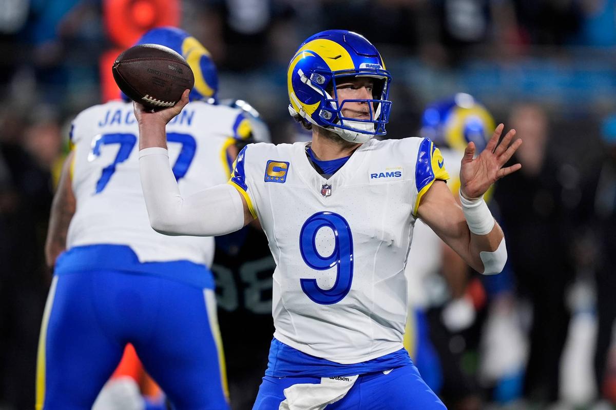  Jan 10, 2026; Charlotte, NC, USA; Los Angeles Rams quarterback Matthew Stafford (9) drops back to pass against the Carolina Panthers in the first half during the NFC Wild Card Round game at Bank of America Stadium. Mandatory Credit: Jim Dedmon-Imagn Images 