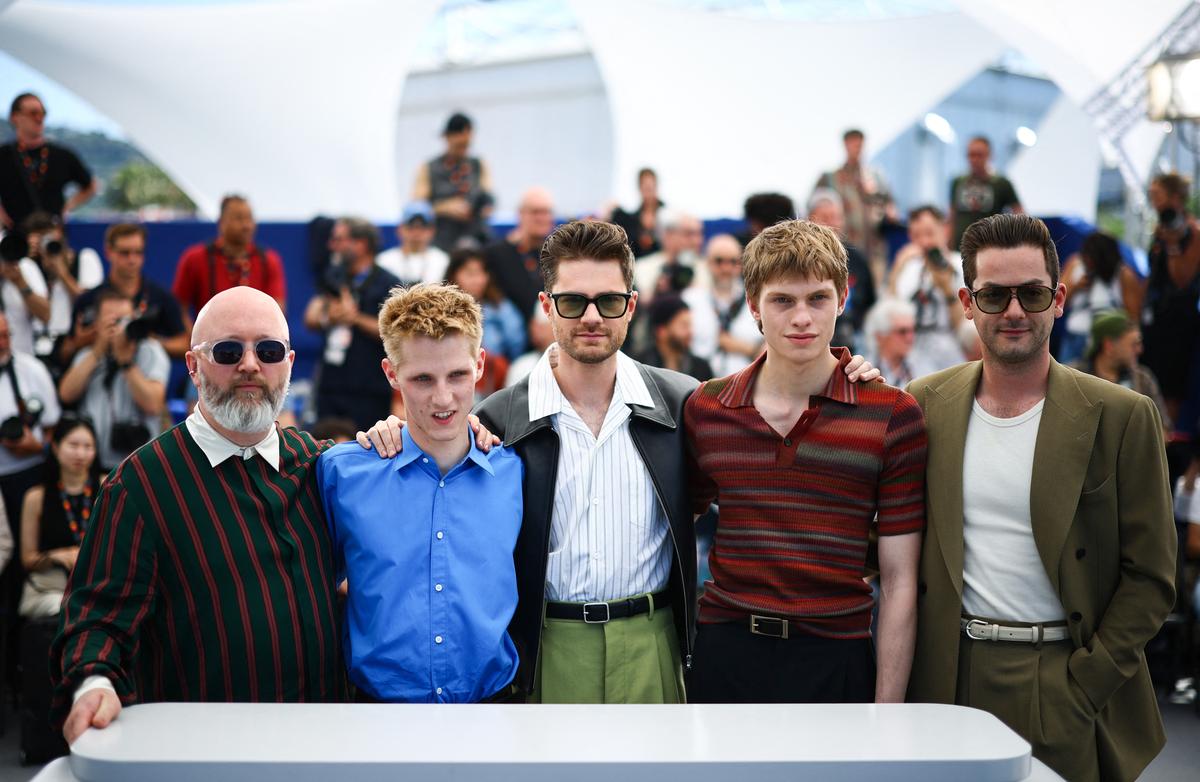 Director Lukas Dhont, cast members Valentin Campagne, Emmanuel Macchia, producer Michiel Dhont and screenwriter Angelo Tijssens pose during a photocall for the film "Coward" in competition at the 79th Cannes Film Festival in Cannes, France, May 22, 2026. REUTERS/Sarah Meyssonnier