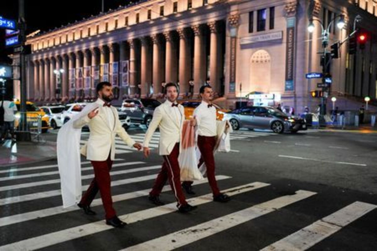 Workers believed to be a part of the reported wedding between singer Taylor Swift and National Football League (NFL) player Travis Kelce, cross a road outside Madison Square Garden, in New York City, U.S., July 3, 2026. REUTERS/Christian Monterrosa