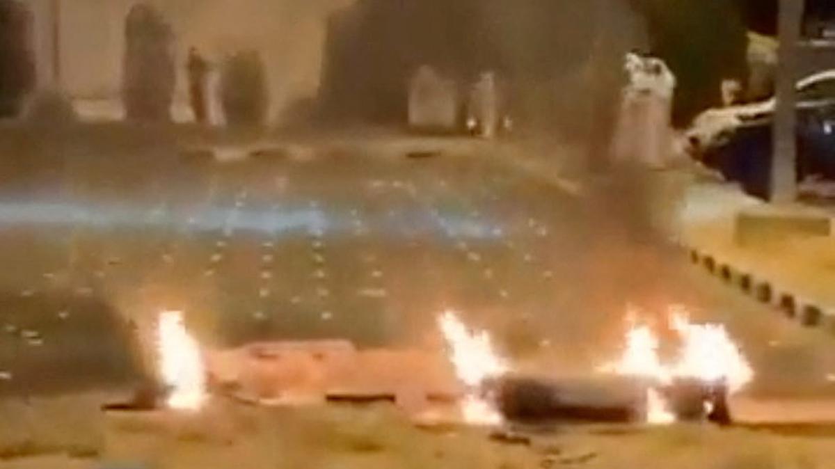 Debris burns on the ground in a parking lot following reports of missile and drone attacks, in Sabah Al Nasser, Kuwait June 3, 2026, in this screengrab obtained from a social media video . SOCIAL MEDIA/via REUTERS