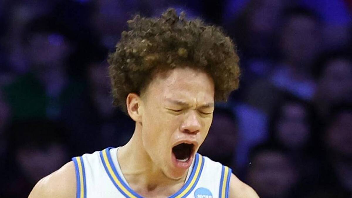  Mar 20, 2026; Philadelphia, PA, USA; UCLA Bruins guard Trent Perry (0) reacts with guard Eric Freeny (8) in the second half during a first round game of the men's 2026 NCAA Tournament at Xfinity Mobile Arena. Mandatory Credit: Bill Streicher-Imagn Images | Bill Streicher-Imagn Images 