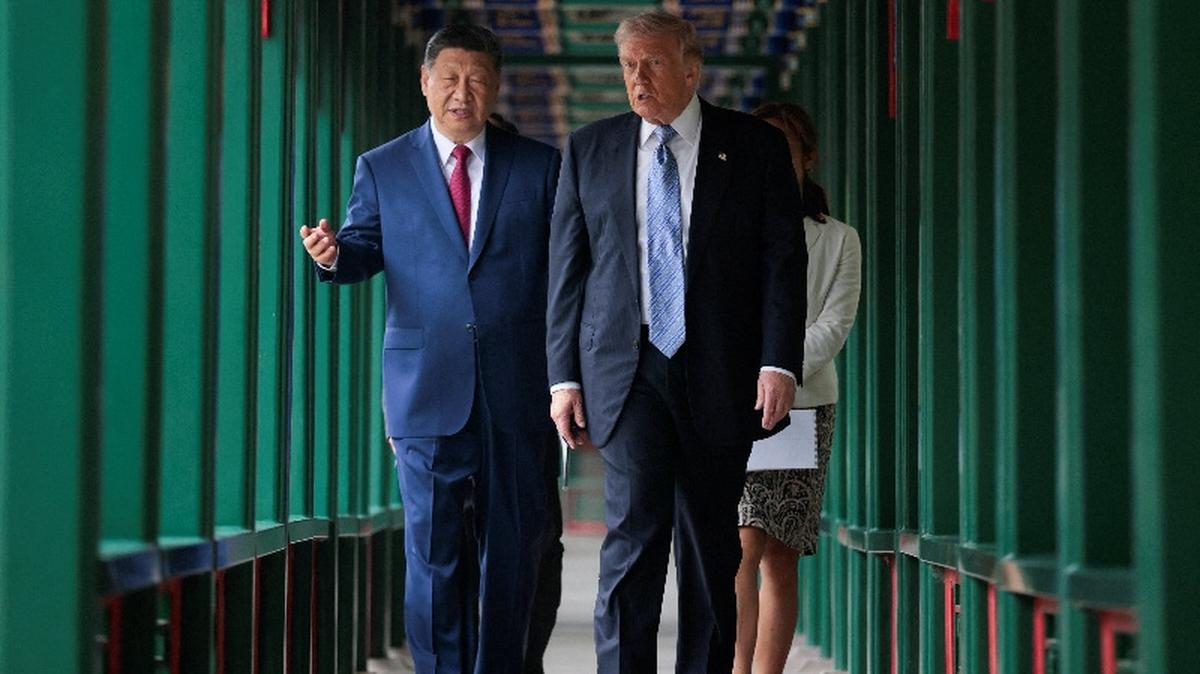 U.S. President Donald Trump participates in a friendship walk through Zhongnanhai Garden with Chinese President Xi Jinping in Beijing, China, May 15, 2026. REUTERS/Evan Vucci/Pool
