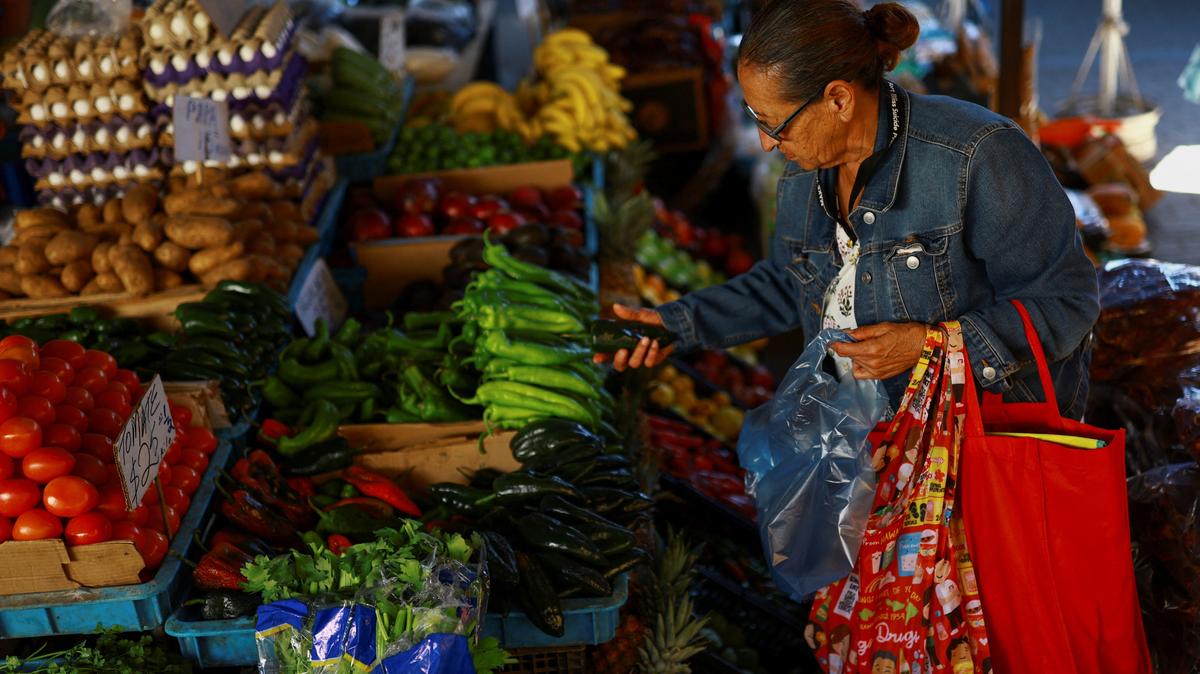 A woman buys vegetables at a market in Ciudad Juarez, Mexico, April 15, 2026. REUTERS/Jose Luis Gonzalez